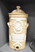 A late Victorian stoneware water filter with cover, inscribed W.M.Jowett & Co and decorated with