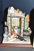 A Border Fine Art 'Cat Curious' figurine of an outside privy and scenes of tam cats, h24cm, includes