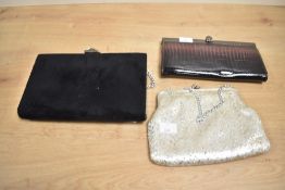 Two lady's clutch bags, (3)