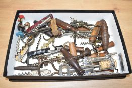 A box containing various vintage corkscrews, to include a metal corkscrew with wooden handle, a