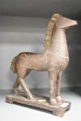 A cast horse sculpture having gilt main and tail, supported on a rectangular plinth, h32cm