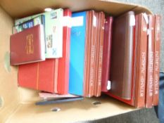 WORLDWIDE STAMP COLLECTIONS IN 17 VOLUMES MINT AND USED Hefty world collections in old fruit box, 17