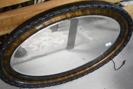 Two oval wall mirrors