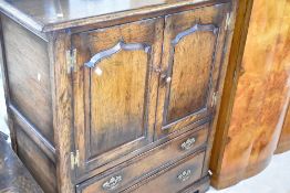 A Titchmarsh and Goodwin oak TV cabinet