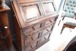 A Titchmarsh and Goodwin oak bureau, width approx. 76cm
