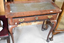 A Georgian and later mahogany side table having leather inset top with frieze drawer and cabriole