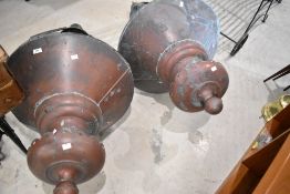 A pair of traditional copper street lamp heads, height approx. 140cm including brackets