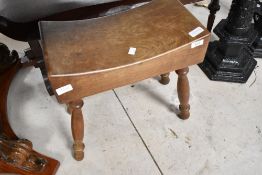 A traditional stool having block style seat and turned legs, approx. 43 x 24cm