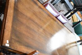 A Titchmarsh and Goodwin oak extending table and twelve (ten plus two) dining chairs