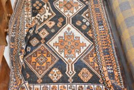 A Persian style rug, approx 230cm