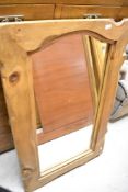 A rustic wall mirror having chunky natural wood frame, approx. 109 x 70cm