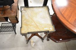 A continental style plant stand having marble effect and galleried top, with applique frieze and