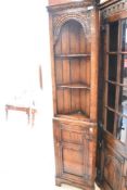 A Titchmarsh and Goodwin oak period style narrow corner shelf with cupboard under