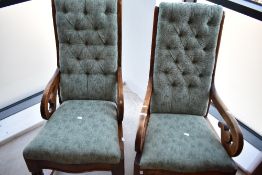A pair of Victorian (ladies and gents) stained frame rocking chairs having later upholstery