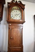 A 19th Century oak and mahogany longcase clock having eight day movement and painted dial, with