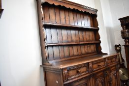 A traditional Titchmarsh and Goodwin oak dresser, width approx. 139cm