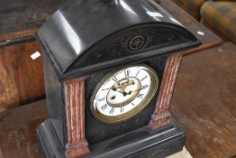 A large Victorian black slate mantel clock