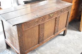 A late 19th or early 20th Century oak coffer , having carved decoration, width approx. 130cm