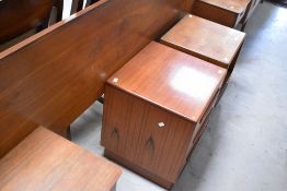 A vintage teak G plan headboard and two beside chests