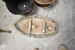 A concrete planter modelled as a boat