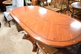 A nice quality reproduction oval dining table having scroll base, approx. 230 x 110cm