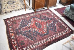 A Persian rug, approx. 195 x 153cm