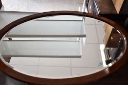An early 20th Century mahogany oval mirror, approx. 91 x 63cm