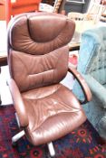 A brown leather office armchair