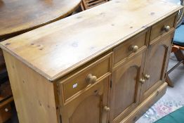 A natural pine triple sideboard, width approx. 122cm