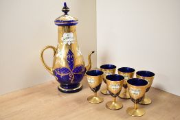 A vintage cut everylay glass tea service, hand decorated with gilding and floral patterns on a