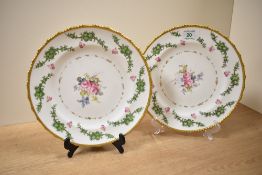 A pair of decorative Royal Crown Derby plates, having gilt rim with hand painted floral