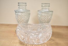 A pair of early 20th century Regency style cut glass lidded urns, having egg shaped body and