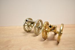 A pair of brass cannons decorated with GR military marks, stamped to base 'Made in England', h9cm