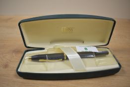 A boxed Cross Century aerometric fill fountain pen in matt black with gold trim having Cross M nib