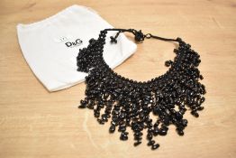 A vintage black onyx style statement collar necklace sold along with a Dolce & Gabbana dust bag