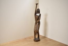 A hand carved wooden sculpture of a man with spear and shield, h50cm