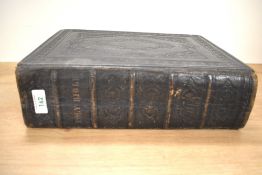 A large leather bound Holy Bible containing the Old and New Testaments, H32cm