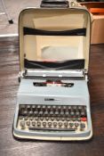 A vintage Olivetti Lettera 32 portable typewriter in carry case