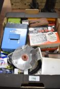 A box of various photographic equipment including Slide Viewer, Film Splicer, Filters, flash bulbs