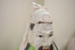 A Chinese hand carved wooden Fu sculpture in tradition dress and cobra, h40cm, sold together with