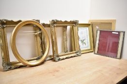A box containing various frames, to include an oval gold colour frame ect, (9)