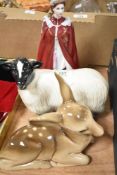 A Royal Worcester porcelain figurine of Queen Elizabeth, h23cm, sold together with a ceramic fawn