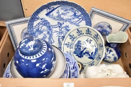 A collection of blue and white ware including a vintage Asian display plate having scalloped edges