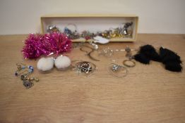 A box containing various woman's jewellery, to include Santa earrings, broaches and necklaces.