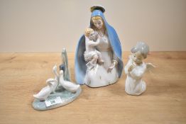 A Ronzan porcelain Madonna and Child, hand coloured in gold and blue, makers mark to base, h21cm,
