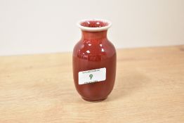 A small Chinese pottery Sang de Boeuf vase, blue four character mark to base, h10cm.