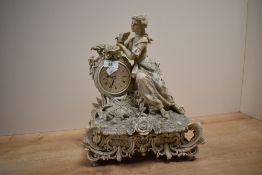 A battery operated figural mantel clock depicting and cherub, measuring 39cm tall, marked 'Crosa'