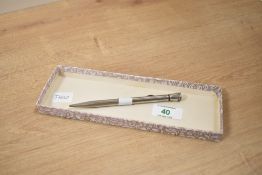 A white metal propelling pencil, marked Edac paris, 13.5cm