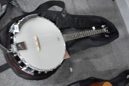 An Ozark 5 string banjo, with gig bag