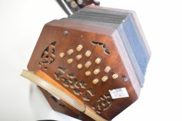 A traditional wooden cased concertina , 30 button, no case